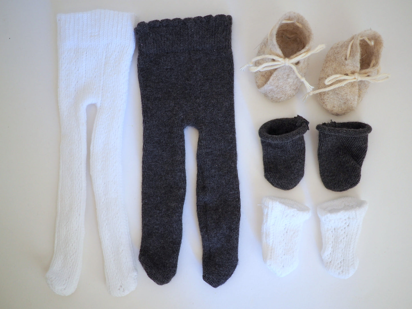 2 pairs of tights, 2 pairs of socks, and a pair of booties for my baby doll